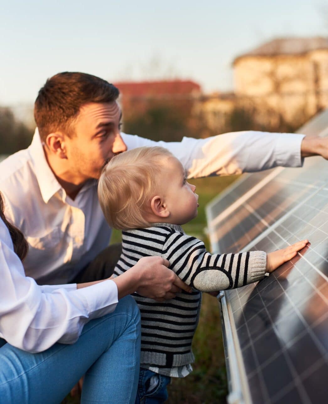 Young Family Looking at Solar Panels